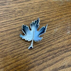 Black and silver tone brooch pin. Unsigned.  Retro.